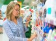 woman looking at products at store wondering about the Benefits of Whiter Teeth