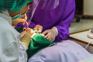 dentists performing oral surgery