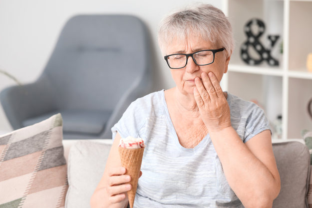 a woman finding out first hand how does tooth decay develop