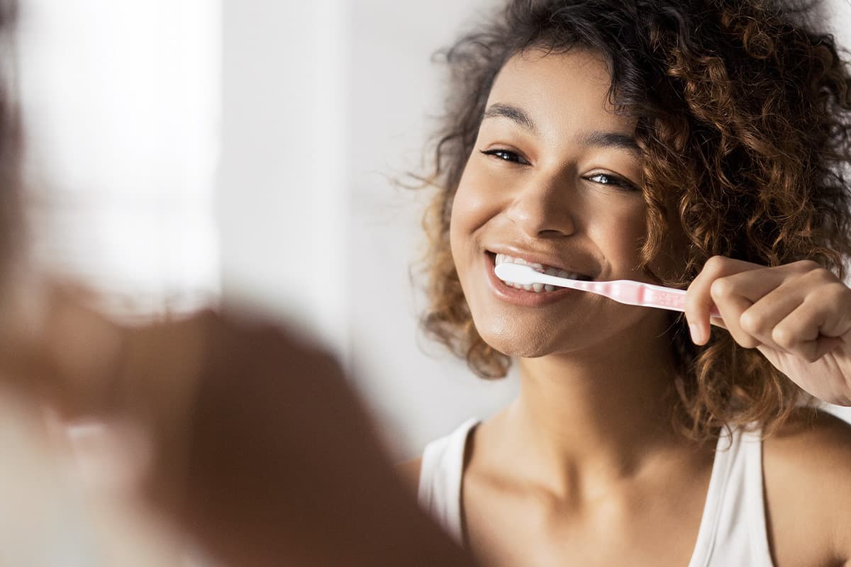 oral care woman brushes teeth after Halloween