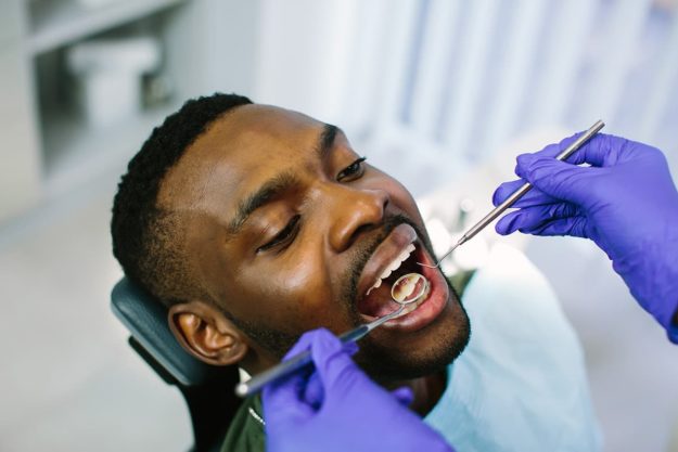 dental exam individual getting dental exam