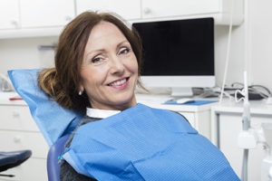 Woman prepares for restorative dentistry services