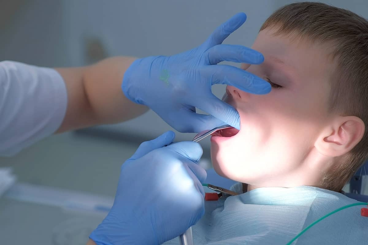 fluoride boy getting a fluoride treatment