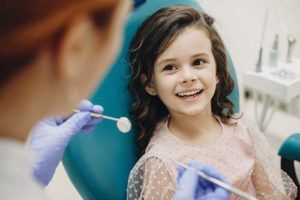 a girl benefits from pediatric dentistry