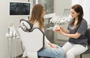 dentist and patient discussing orthodontics